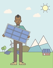 Image showing Man with solar panels and wind turbines.