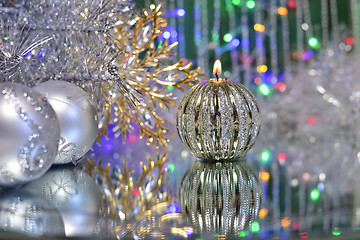 Image showing Christmas decorations with candle and silver balls.