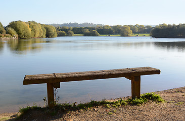 Image showing Rustic bench by a lake