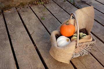 Image showing Pumpkins in a hessian-lined basket 