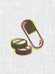 Image showing Healthcare concept: Pills on fabric texture background