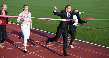 Image showing business people running on racing track