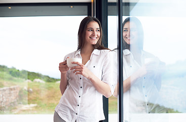 Image showing beautiful young woman drink first morning coffee