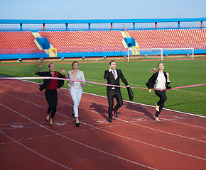 Image showing business people running on racing track