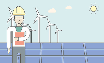 Image showing Man with solar panels and wind turbines.