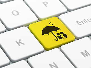 Image showing Security concept: Family And Umbrella on computer keyboard background