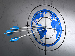 Image showing Studying concept: arrows in Globe target on wall background