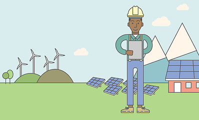 Image showing Man with solar panels and wind turbines.