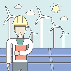 Image showing Man with solar panels and wind turbines.