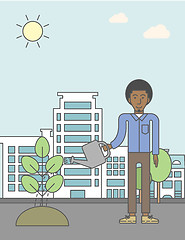 Image showing Man watering tree.