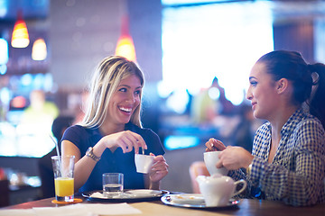 Image showing girls have cup of coffee in restaurant