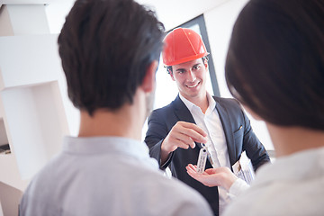 Image showing couple buying new home with real estate agent