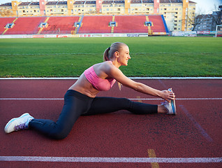 Image showing sporty woman on athletic race track