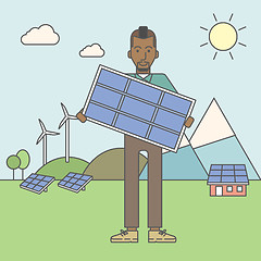 Image showing Man with solar panels and wind turbines.