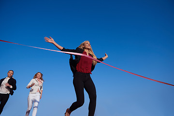 Image showing business people running on racing track