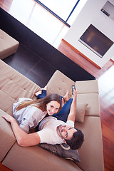 Image showing young couple watching tv at home