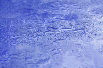 Image showing Blue surface with poured water