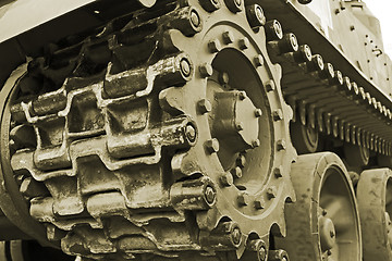 Image showing Tracked military equipment close-up, toned