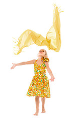 Image showing Little Girl in a Yellow Dress throws up Shawl