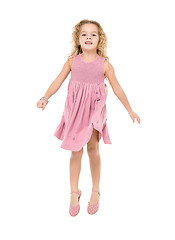 Image showing Little Girl in a Pink Dress Jumping