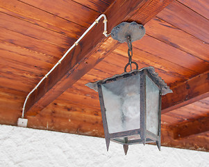 Image showing Vintage looking metal lantern with modern lamp