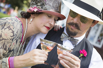 Image showing Mixed-Race Couple Dressed in 1920’s Era Fashion Sipping Champa