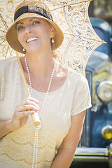 Image showing 1920s Dressed Girl with Parasol Near Vintage Car Portrait