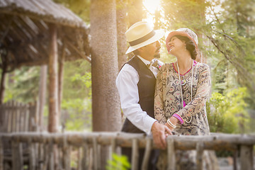 Image showing 1920s Dressed Romantic Couple on Wooden Bridge