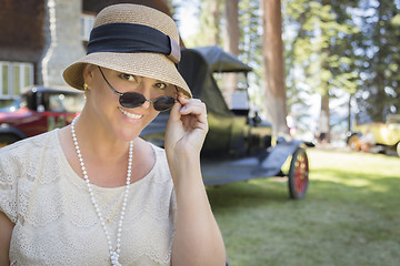 Image showing 1920s Dressed Girl Near Vintage Car Outdoors Portrait