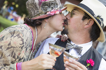 Image showing Mixed-Race Couple Dressed in 1920’s Era Fashion Sipping Champa