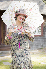 Image showing 1920s Dressed Girl with Parasol and Glass of Wine Portrait