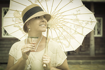 Image showing 1920s Dressed Girl with Parasol and Glass of Wine Portrait