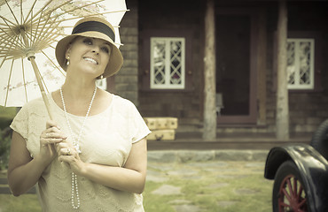 Image showing 1920s Dressed Girl with Parasol Near Vintage Car Portrait