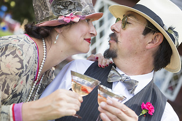 Image showing Mixed-Race Couple Dressed in 1920’s Era Fashion Sipping Champa