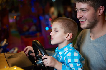 Image showing father and son playing game in playground