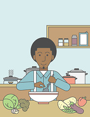 Image showing Man cooking meal.