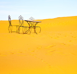 Image showing table and seat in desert sahara morocco africa yellow sand