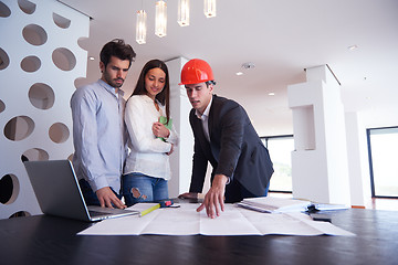 Image showing couple buying new home with real estate agent