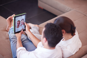 Image showing couple at modern home using tablet computer