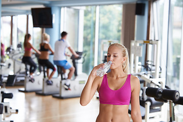 Image showing woman in fitness gym drink water