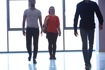 Image showing student girl standing with laptop, people group passing by