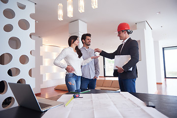 Image showing couple buying new home with real estate agent