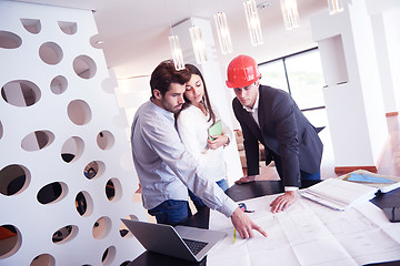 Image showing couple buying new home with real estate agent