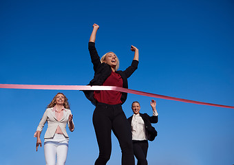 Image showing business people running on racing track