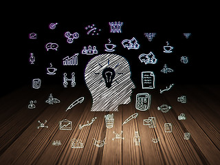 Image showing Finance concept: Head With Light Bulb in grunge dark room