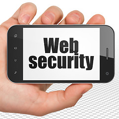 Image showing Safety concept: Hand Holding Smartphone with Web Security on display