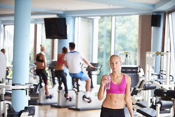 Image showing woman in fitness gym drink water