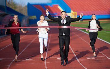 Image showing business people running on racing track