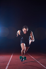 Image showing Sprinter leaving starting blocks