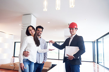 Image showing couple buying new home with real estate agent